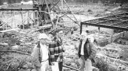 Mervyn Upham, R.C. Hart and Franc Joubin watch the construction of the headframe and mill building of the Quirke uranium mine near Elliot Lake, Ont., in the late spring of 1955.