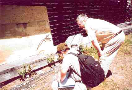 Johan Aler (left) of Canaccord Capital and Gerry Squires of Thundermin Resources examine core from the Duck Pond deposit.