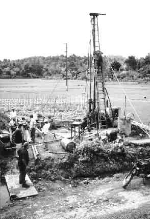 A drill rig tests a target at the Nui Phao polymetallic project in Vietnam.