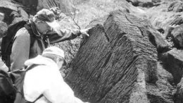 Thomas Patton (background) points to magmatic layering at the Union Bay platinum project in Alaska.