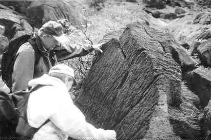 Thomas Patton (background) points to magmatic layering at the Union Bay platinum project in Alaska.