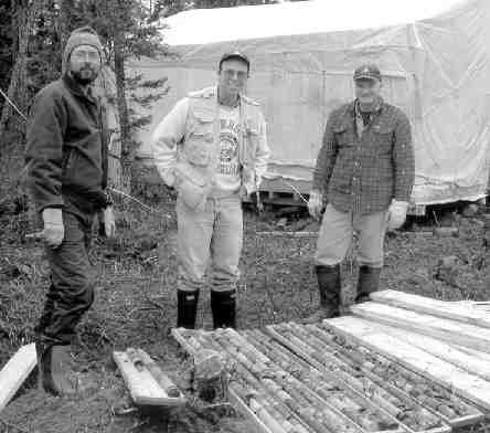 Tyson Birkett, a representative of Soquem, Brooke Clements, Ashton's vice-president of exploration, and Robert Lucas, project manager of Ashton Quebec, stand near drill core samples from the Otish Mountains.