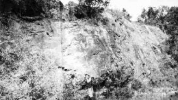 Geologists from Radius Exploration examine a mineralized outcrop at the El Tambor property in Guatemala.