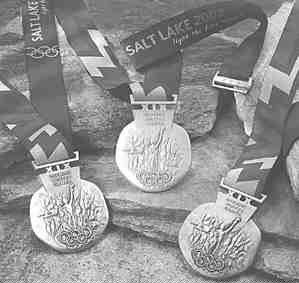 The silver (left), gold and bronze medals made for the 2002 Olympic Winter Games in Salt Lake City, Utah. Each medal consists of metals mined from the Kennecott Utah Copper mine in Salt Lake Valley.