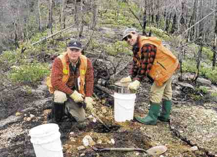 Robert Lucas, Ashton's manager of Quebec projects, and Ghislain Poirier of Soquem take samples on an esker in the Otish Mountains region of Quebec.