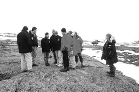 Analytst and geologists look at the surface outcropping of the Hinge zone of Miramar Mining's Doris deposit, where a "starter" open pit is in the planning stages.