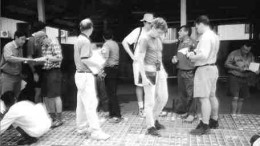 John Felderhof, near pillar at right, shows library core to mining analysts at Busang.