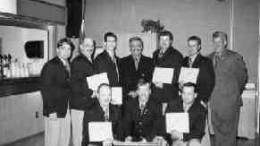 The Falconbridge Craig-Lockerby team receives its Ontario mine rescue championship plaques. From left in front: James Lundrigan, Thomas Dwyer and Ronald Cormier. In back from left: Dan McIntosh, Brian Benoit, Peter Xavier, Parvis Farsangi (Falco general manager in Sudbury), David Lachance, Marc Girard and John Hagan (mine rescue officer with the Mines and Aggregates Safety and Health Association).