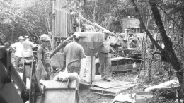 Workers operate a percussion drill rig during Aurogin Resources' August drilling program at the Moose River gold project in north-central Nova Scotia.