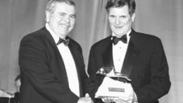 Photo by Henry KoroEdward Thompson, chairman of the awards committee, presents the Viola R. MacMillan Developer's Award to James Excell, president and CEO of BHP Billiton Canada.