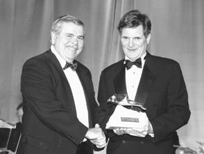 Photo by Henry KoroEdward Thompson, chairman of the awards committee, presents the Viola R. MacMillan Developer's Award to James Excell, president and CEO of BHP Billiton Canada.