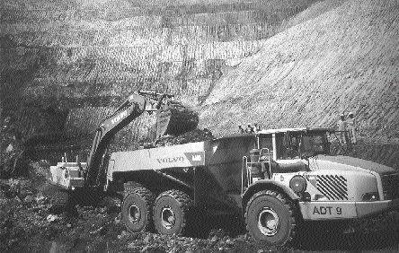 An excavator loads a haul truck at First Quantum Minerals' Lonshi open pit mine in southeastern Katanga. Waste and ore at Lonshi are easily rippable.