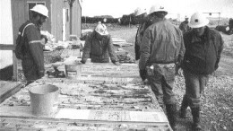 Analysts examine core from the Boston deposit during a visit in 2000.