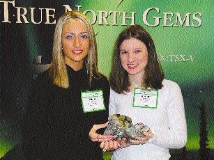 The hunt for precious stones in Canada also extends to emeralds and sapphires. Above, Holly Johnson, an office administrator with True North Gems, and geologist Bonnie Pemberton hold emerald and sapphire mineralization from the Yukon and Baffin Island, respectively.