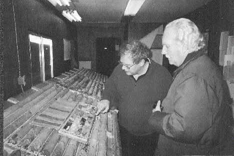 Wayne Reid, St. Andrew Goldfields' exploration manager, and Ellsworth Dickson of Resource World Magazine examine drill core at the Stock Mine east of Timmins.