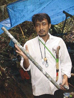 A local geologist holds massive quartz-copper mineralization from the Baroi project in Indonesia.