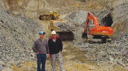 Canadian Arrow Mines Vice President of Exploration Paul Davis (left) and President David Larche stand in front of the bulk sampling operations at the Alexo Nickel property northeast of Timmins, Ont.