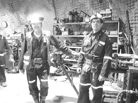 From left to right: Pierre Jeansomme, geological technician and Michel Lafleur, mine captain, underground in the machine shop at Wesdome's Kiena mine.