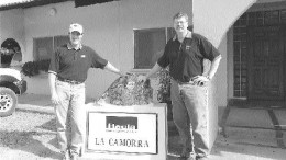 From left to right: Phillips Baker Jr., president of Hecla Mining and Thomas Fudge Jr., vice-president of operations and president of Hecla Venezuela, stand by ore displayed at Hecla's La Camorra mine.