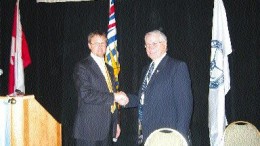 Photo by Stephen StakiwMichael Gray (left), president of the British Columbia & Yukon Chamber of Mines, with the province's mines minister, Richard Neufeld, at the opening ceremony of the 2005 Mineral Exploration Roundup in Vancouver.