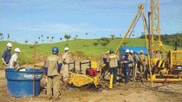 Workers test Canico Resource's Ona-Puma nickel laterite project.