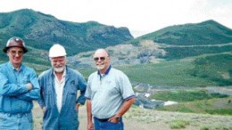 At the Jerritt Canyon property in Nevada's Independence Mountain range, from left: Nigel Bain, general manager at Jerritt Canyon; Chris Davie, Queenstake Resources president and CEO; and Ted Wilton, district exploration manager at Jerritt Canyon. In the near background are the surface buildings at the SSX portal, and in the far background, some exhausted open pits.