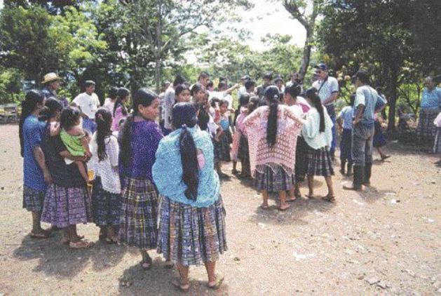 Qeqchi gather in a village just northwest of the Exmibal ferronickel plant on Guatemala's Lake Izabal.