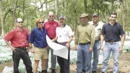 Photo by Pattie BealesEquinox Minerals personnel at the Mulandwe RC sample farm, from left: Kevin van Niekerk, vice-president investor relations and corporate development; Greg Winch, chief exploration geologist; Bruce Nisbet, vice-president exploration; Michael Richards, exploration manager for Africa; Craig Williams, president; Noel McNee, Lumwana site operations and technical manager; and Harry Michael, chief operating officer.