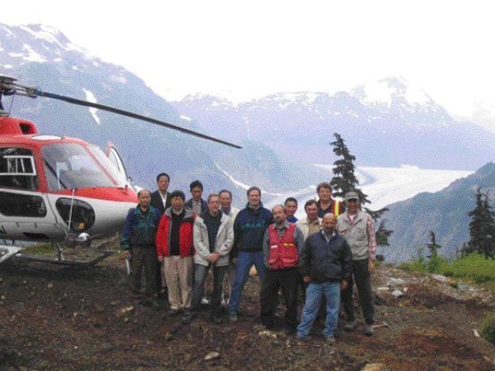 Front row, second from left, Zijin Mining Group Chairman Chen Jing He, on his left is Pinnacle Mines President and CEO Andrew Bowering, followed by Pinnacle Mines Chairman Paul Saxton. Pinnacle Director Bradford Cooke is on the far right (with cap). The officers of both companies visited the Silver Coin gold-silver-base metal project, near Stewart, in northwestern B.C.