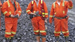 From left: Yukon Zinc President Harlan Meade, Project Geologist Gilles Dessureau, and Vice-President of Mining Richard Goodwin hold some of the first ore to be brought out of the portal at the Wolverine zinc-copper-lead deposit in eastern Yukon.