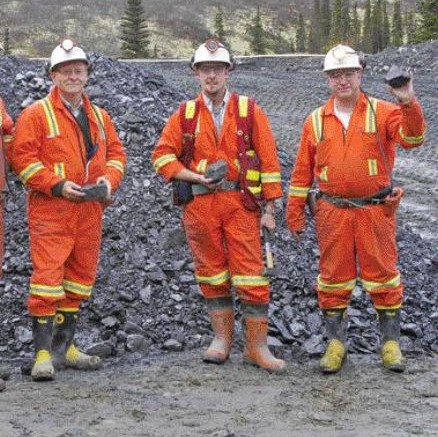 From left: Yukon Zinc President Harlan Meade, Project Geologist Gilles Dessureau, and Vice-President of Mining Richard Goodwin hold some of the first ore to be brought out of the portal at the Wolverine zinc-copper-lead deposit in eastern Yukon.