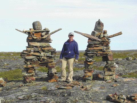 Diamonds North exploration geologist Dale Mah stands between two Inukshuks, an Inuit word meaning "likeness of a person," on the company's 14,500-sq.-km Hepburn diamond property in the Northwest Territories, 300 km north of Yellowknife on the western margin of the Slave craton. Senior Staff Writer Rob Robertson looks at diamond exploration activity in Canada's Far North.