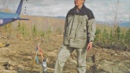 Basil Botha, president of Cash Minerals, stands near a recent drill hole at the company's Division Mountain project in the Yukon.