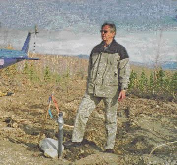 Basil Botha, president of Cash Minerals, stands near a recent drill hole at the company's Division Mountain project in the Yukon.