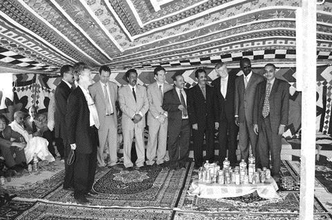 All smiles, no alcohol: Rio Narcea Gold Mines management and government officials gather under a tent in the Sahara desert to celebrate the beginning of construction at the Tasiast gold project in Mauritania.