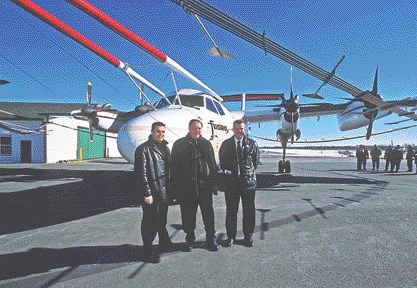 Past, better days. From left: Normand Dupras, Falconbridge's exploration manager in the Bathurst base metal camp; Keith Ashfield, New Brunswick's minister of Natural Resources; and Slam Exploration president Mike Taylor together at an airport in New Brunswick in 2003 after all three parties had reached a 5-year agreement to use MegaTEM surveys to explore for new deposits that might extend the life of Falconbridge's 41-year-old Brunswick base metal operation in the Bathurst camp. Falconbridge recently walked away from the Bathurst joint venture after Slam did not produce the necessary funds for this year's exploration program.