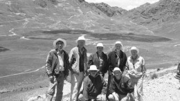 The Northern Peru Copper team (back row, from left): Senior geologist Carlos Miranda, country manager Hal Waller, president and CEO Marshall Koval, vice-president of exploration Leo Hathaway, and director Tony Floyd. In front is project manager Jeff O'Toole (left), and vice-president of corporate development David Strang. The main Galeno deposit and exploration camp are in the background.