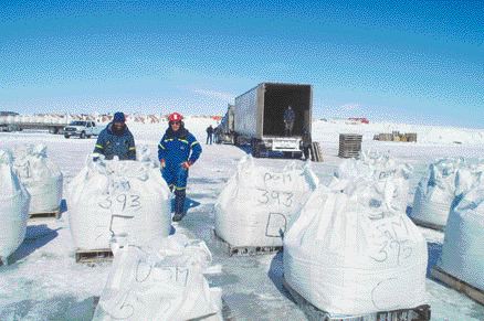 De Beers geologist Clement Rikhotso (left), and senior project manager Martin Podolsky with bulk samples from the Gahcho Ku diamond project in the Northwest Territories.