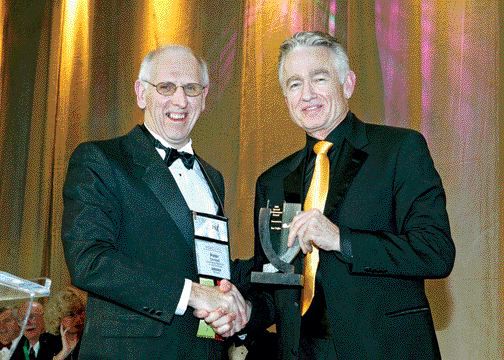 ENVISIONDIGITALPHOTO.COMOutgoing PDAC president Peter Dimmel presents the Special Achievement Award to Ian Telfer, president of Goldcorp.