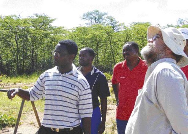 ANTHONY VACCARORockover Resources project manager Luckson Manda (far left) with SouthernEra project manager Paul Allan (far right). The two companies are partners on the Tsholotsho diamond project in Zimbabwe.