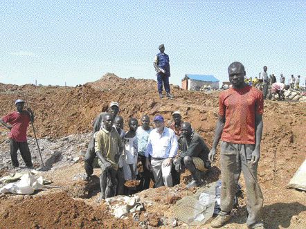 In February 2005, Anvil Mining president William Turner poses with artisanal cobalt miners at a site a few kilometres outside the town of Mutoshi where the company operates the Kulu copper mine. Local protesters recently killed two of Anvil's staff at Kulu following the death of local artisanal miner, 30-year-old Kayembe Mukoj, allegedly at the hands of Anvil security personnel.BY THE NORTHERN MINER