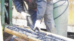 ACADIAN GOLD<A driller handles core on the Main zone at Acadian Gold's Beaver Dam gold project in Nova Scotia.