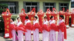 MICHELAGOA traditional Chinese ceremony in July 2005 marks the transfer of the bacterial oxidation plant in the gold-mining town of Laizhou, Shandong province, to Aussie miner, Michelago. The pillars in the background represent wisdom. And the women are holding trays of flowers, each with a pair of scissors to cut the opening ribbon. The BacOx plant, the largest of its kind in China, processes third-party concentrates at a rate of about 150,000 oz. gold annually and is key to an impending merger between Toronto-based Golden China Resources and Michelago.