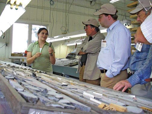 BY RYAN WALKERAlexis Minerals geologist Sophie Lafontaine discusses core from the Louvex VMS project, near the Louvicourt copper-zinc mine, not far from Val d'Or, Que.