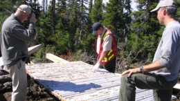 (from the left) Mining analyst Glenn Brown, Aurora Energy chief scientist Rick Valenta and vice-president of exploration Ian Cunningham-Dunlop examine drill core at the Jacques Lake project in coastal Labrador's Central Mineral Belt.