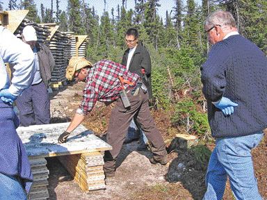 VIRGINIA HEFFERNANMatoush project geologist Jonathan Lafontaine examines the core from hole MT-06-10 as Strateco Resources president Guy Hbert looks on.