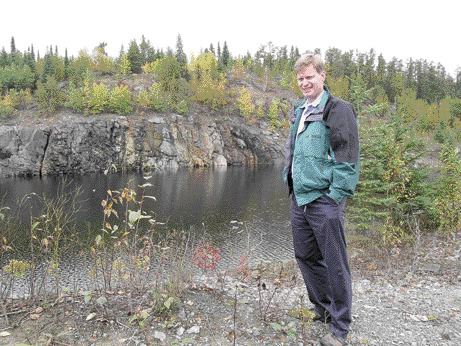 THE NORTHERN MINERRobin Dunbar, president of Mustang Minerals, stands near the flooded Maskwa open pit, northeast of Winnipeg in 2004.