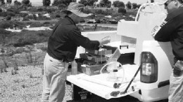 AUSTRALIAN MINERAL FIELDSHydrogeochemical sampling in southeastern Western Australia. The filtration unit on the back of the truck analyzes water from streams for a range of pathfinder elements and economic metals. This method allows a large drainage area to be sampled quickly.