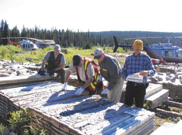 BY STEPHEN STAKIWFrom left: Aurora Energy's vice-president of exploration Ian Cunningham-Dunlop, chief geoscientist Rick Valenta, and mining analysts Glenn Brown and Jay Turner examine drill core at the Michelin deposit, situated in coastal Labrador's Central Mineral Belt.