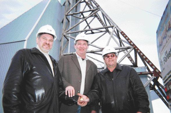 BY SUSAN KIRWINAnyone lose a button? From left: Yves Gagnon, Serge Roy and Ghislain Morin hold the last 6 oz. of gold poured at the Bachelor Lake mill in 1989. The mill is currently undergoing a $3-million facelift and will be ready to take ore from the Barry Lake open-pit deposit by mid-August.